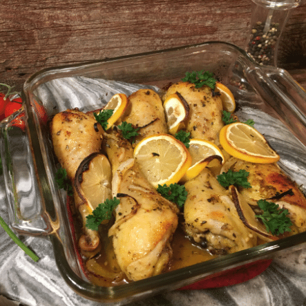 Baked mediterranean chicken legs with lemon and herbs.